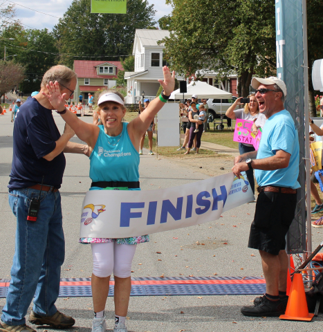 Peggy Faber finishing her 50th State marathon while battling Parkinson's Disease